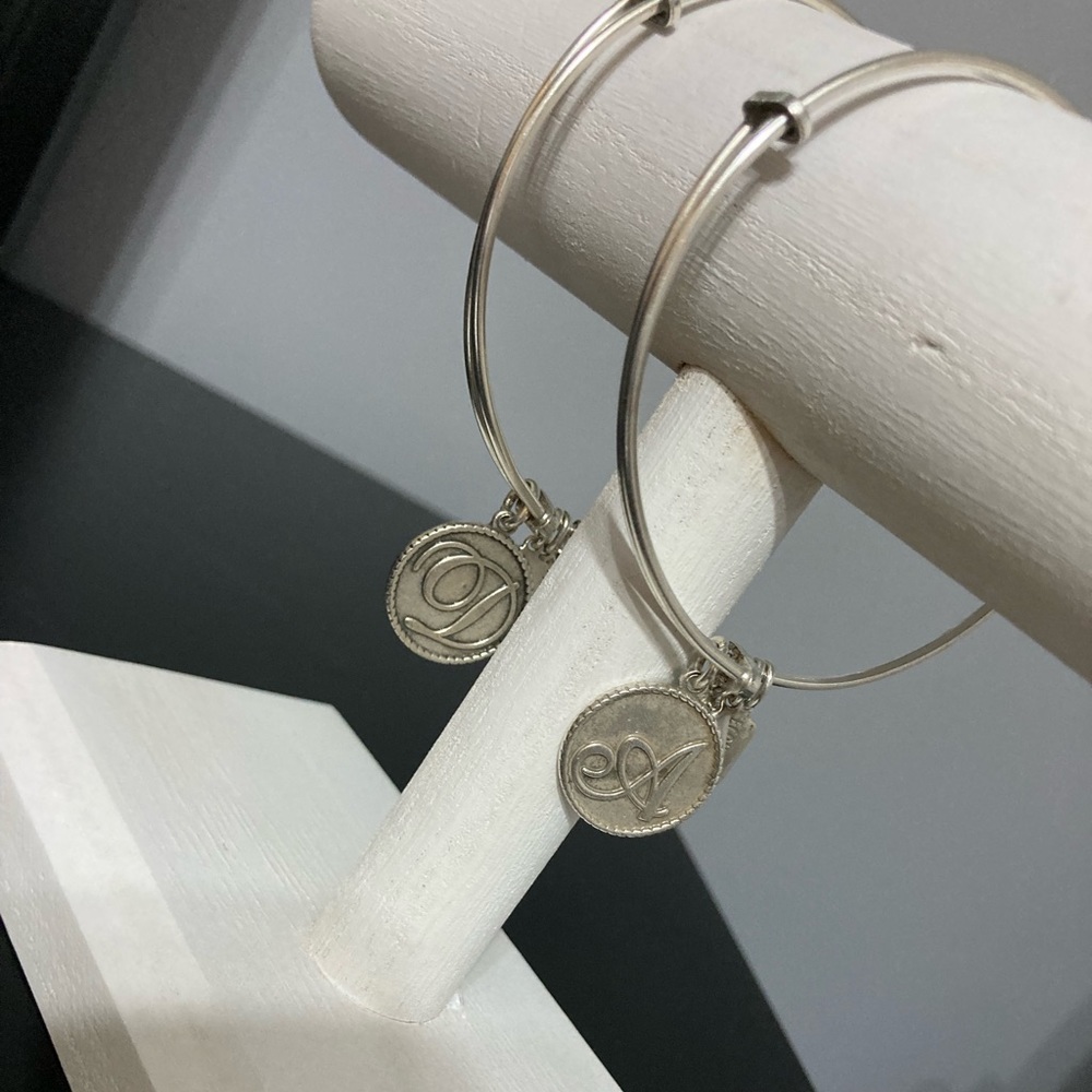 Wind and Fire bracelets pre-owned silver tone initial A and D, adjustable